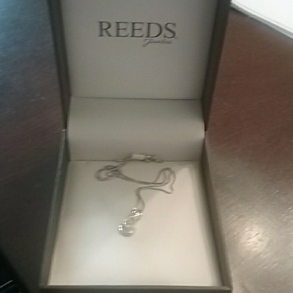 Silver and diamond infinity necklace